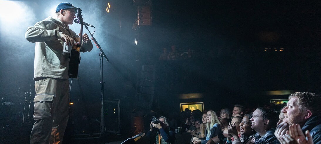 Dermot Kennedy interating with the crowd at a gig in Auckland, New Zealand